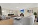 Bonus room with stylish decor including a fireplace, media console, and comfortable seating at 2680 Lookout Ln, Kissimmee, FL 34746