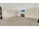 Expansive bonus room with neutral carpet and walls, a fireplace, and TV at 2680 Lookout Ln, Kissimmee, FL 34746