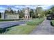 The Bellalago community entrance with elegant signage, manicured landscaping, and guardhouse at 2680 Lookout Ln, Kissimmee, FL 34746