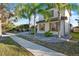Two-story home featuring decorative shutters, manicured landscaping, and an inviting walkway at 2680 Lookout Ln, Kissimmee, FL 34746