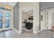 Inviting foyer with decorative glass door leading into an office space, and gorgeous flooring at 2680 Lookout Ln, Kissimmee, FL 34746