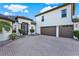 Beautiful home featuring a three-car garage, meticulously kept landscaping, and a paved driveway at 2680 Lookout Ln, Kissimmee, FL 34746