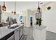 Bright kitchen with stainless steel appliances, quartz countertops, and views of the living area at 2680 Lookout Ln, Kissimmee, FL 34746