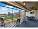 The screened patio offers outdoor dining and relaxation space and has a grill for cooking at 2680 Lookout Ln, Kissimmee, FL 34746