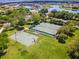 Aerial view of the tennis and basketball courts available to residents at 2680 Lookout Ln, Kissimmee, FL 34746