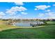 Picturesque water view featuring docks and verdant landscaping, perfect for tranquil living and leisure at 2680 Lookout Ln, Kissimmee, FL 34746