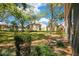 View of lush backyard landscaping and mature trees surrounding the property at 3038 Clubview Dr # Ge, Orlando, FL 32822