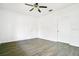 Neutral bedroom boasts wood-look flooring and ample closet space at 3038 Clubview Dr # Ge, Orlando, FL 32822