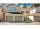 Inviting townhome featuring a two-car garage, neutral tones, and a well-maintained roof at 3038 Clubview Dr # Ge, Orlando, FL 32822