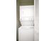 Convenient laundry area with stacked washer and dryer units at 3038 Clubview Dr # Ge, Orlando, FL 32822