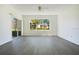 Bright and airy living room featuring wood floors and a large window view at 3038 Clubview Dr # Ge, Orlando, FL 32822