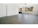 Bright living room with wood floors, sliding glass doors, and a view of trees at 3038 Clubview Dr # Ge, Orlando, FL 32822