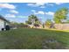 Spacious backyard featuring mature trees, lush lawn, and a privacy fence, creating a serene outdoor space at 3121 Heartwood Ave, Winter Park, FL 32792