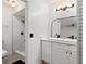 Bathroom with modern fixtures, a sleek vanity, and a beautifully tiled shower space at 3121 Heartwood Ave, Winter Park, FL 32792