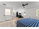 Bright bedroom with neutral walls, tile floor, and a large window for ample natural light at 3121 Heartwood Ave, Winter Park, FL 32792