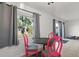 Bright dining area with three windows and unique pink chairs at 3121 Heartwood Ave, Winter Park, FL 32792