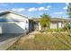 Well-maintained home exterior features a charming front porch with a white garage door at 3121 Heartwood Ave, Winter Park, FL 32792