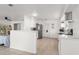 Bright kitchen features white cabinetry, stainless steel appliances, and tile flooring at 3121 Heartwood Ave, Winter Park, FL 32792