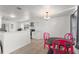 Modern kitchen and adjacent dining area showcasing plenty of natural light at 3121 Heartwood Ave, Winter Park, FL 32792