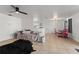 View of open-concept living room with tile flooring and access to dining area and kitchen at 3121 Heartwood Ave, Winter Park, FL 32792