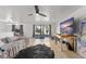 Open living room features a large TV and sliding doors to the backyard at 3121 Heartwood Ave, Winter Park, FL 32792