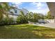 Private backyard featuring a swimming pool, lush landscaping, and inviting lounge area at 3322 Helen Ave, Orlando, FL 32804