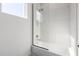 Modern bathroom featuring a sleek bathtub with glass enclosure and chrome showerhead at 3322 Helen Ave, Orlando, FL 32804