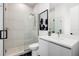 Modern bathroom featuring a glass-enclosed shower, sleek vanity with white countertops, and stylish tile floors at 3322 Helen Ave, Orlando, FL 32804