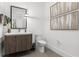 Clean and stylish bathroom with a modern vanity, toilet, and contemporary decor at 3322 Helen Ave, Orlando, FL 32804