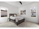 Cozy bedroom with a wooden bed frame, plush bedding, and bright natural light at 3322 Helen Ave, Orlando, FL 32804