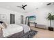 Well-lit bedroom with modern decor, a plush rug, and sleek furnishings for a comfortable retreat at 3322 Helen Ave, Orlando, FL 32804
