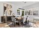 Bright dining room with large windows, a modern chandelier, and a stylish sideboard at 3322 Helen Ave, Orlando, FL 32804