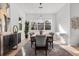 Elegant dining room featuring modern decor, a large plant, and lots of natural light at 3322 Helen Ave, Orlando, FL 32804