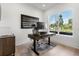 Bright home office with a large window, a wooden desk, and natural lighting at 3322 Helen Ave, Orlando, FL 32804