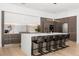 Modern kitchen with white countertops, wood cabinets, stainless steel appliances, and an island at 3322 Helen Ave, Orlando, FL 32804