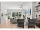 Open living room with a fireplace, large windows, and modern furnishings, offering a cozy ambiance at 3322 Helen Ave, Orlando, FL 32804
