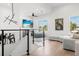 Second floor living space featuring modern decor, mounted TV, and lots of natural light at 3322 Helen Ave, Orlando, FL 32804
