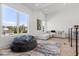 Bright upstairs living room with a comfortable seating area, large windows, and an open floor plan at 3322 Helen Ave, Orlando, FL 32804