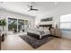 Expansive main bedroom featuring hardwood floors, a cozy rug, and sliding glass doors to the outdoor patio at 3322 Helen Ave, Orlando, FL 32804
