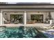 A luxurious outdoor space featuring a pool, dining and seating areas, perfect for entertaining at 3322 Helen Ave, Orlando, FL 32804