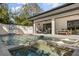 Beautiful pool and spa with an outdoor seating area, basketball hoop, and white fencing at 3322 Helen Ave, Orlando, FL 32804