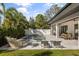 Beautiful backyard pool with lounge chairs, a basketball hoop, and outdoor dining area, ideal for relaxation at 3322 Helen Ave, Orlando, FL 32804