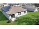 This home features a lush, green backyard with ample space for outdoor activities and relaxation at 355 Gardenia Ct, Kissimmee, FL 34759