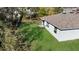 An aerial view of the backyard showcasing lush lawn, providing plenty of outdoor space for relaxation and activities at 355 Gardenia Ct, Kissimmee, FL 34759