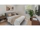 Cozy bedroom featuring a large window, stylish decor, and comfortable furnishings at 355 Gardenia Ct, Kissimmee, FL 34759