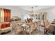 Elegant dining room with formal table setting, decorative lighting, and luxury furniture at 355 Gardenia Ct, Kissimmee, FL 34759