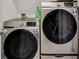 Laundry room with modern Samsung washer and dryer for convenient home living at 355 Gardenia Ct, Kissimmee, FL 34759