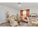 Luxurious living room showcasing decorative furniture, curtains, and a coffee table at 355 Gardenia Ct, Kissimmee, FL 34759