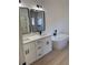 A spacious bathroom featuring a double sink vanity and a freestanding tub at 4031 Sw 130Th Loop, Ocala, FL 34473