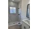 Modern bathroom with tiled shower, glass door, updated vanity, and black fixtures at 4031 Sw 130Th Loop, Ocala, FL 34473